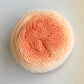 Soft pastel dark orange ombre yarn