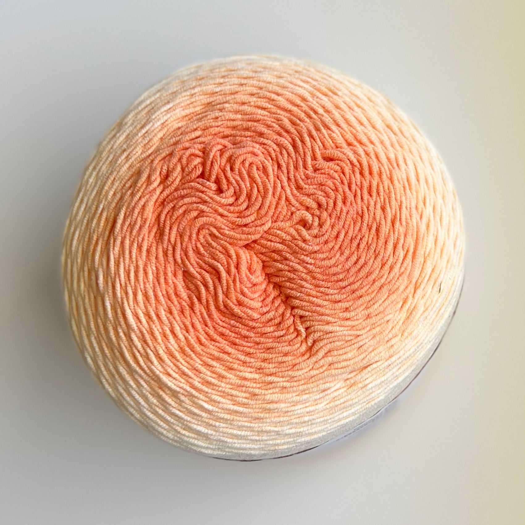 Soft pastel dark orange ombre yarn